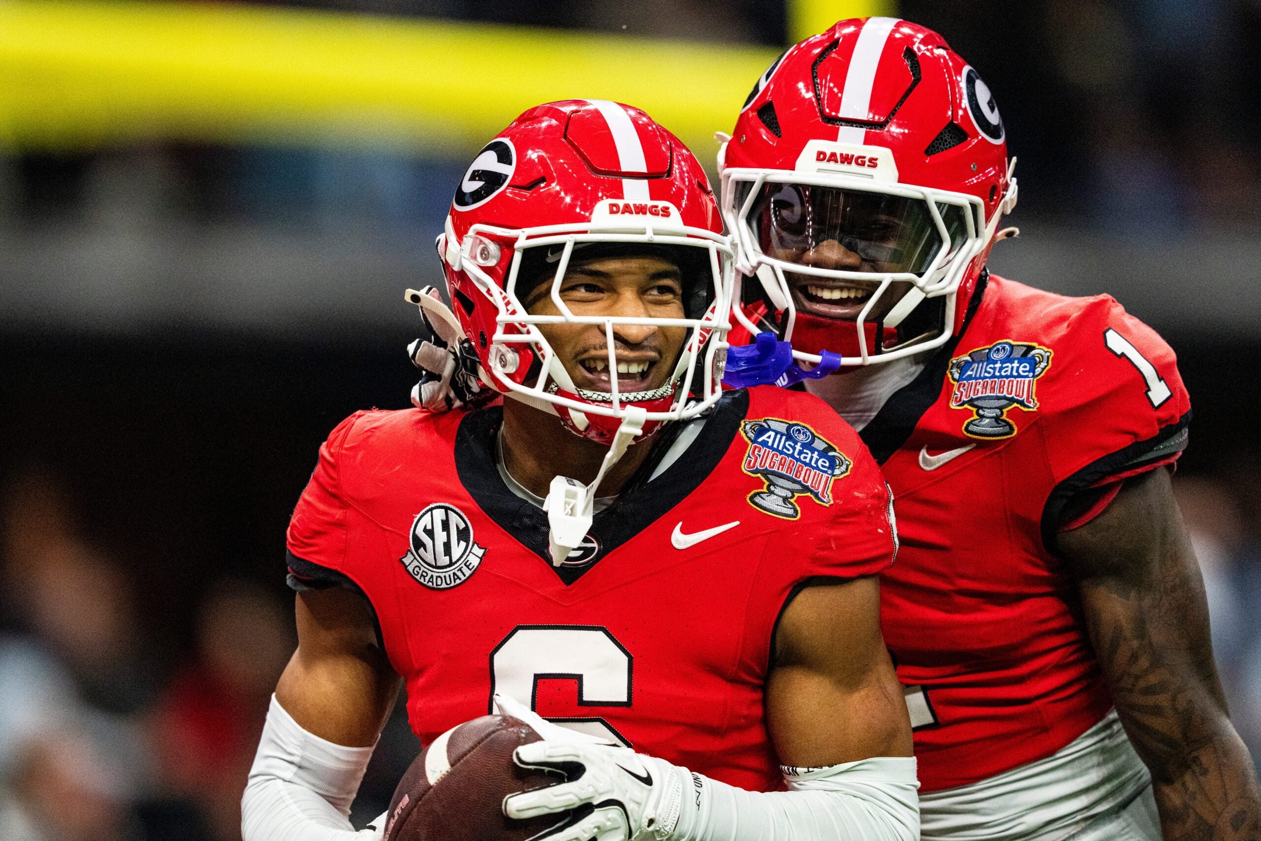 Georgia defensive back Daylen Everette (6) celebrates with Georgia defensive back Ellis Robinson IV (1) after returning a fumble for a touchdown during the Sugar Bowl and College Football Playoff quarterfinals at Caesars Superdome in New Orleans, La., on Thursday, Jan. 1, 2026. Ole Miss defeated Georgia 39-34.