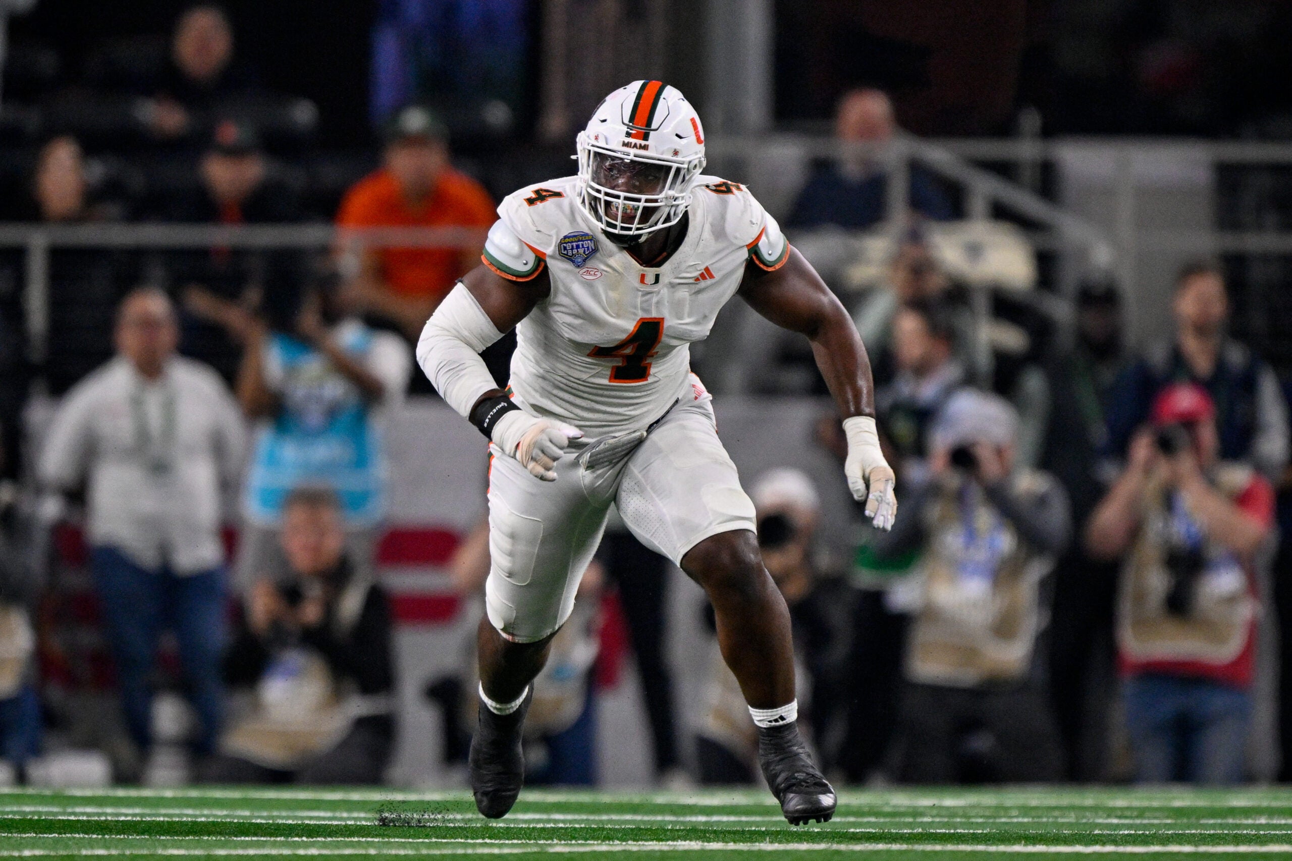 Arlington, TX, USA; Miami Hurricanes defensive lineman Rueben Bain Jr. (4) rushes the line during the 2025 Cotton Bowl and quarterfinal game of the College Football Playoff at AT&T Stadium.