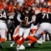 Cincinnati Bengals quarterback Joe Burrow (9) rolls out to hand off in the first quarter of the NFL Week 18 game between the Cincinnati Bengals and the Cleveland Browns at Paycor Stadium in Downtown Cincinnati on Sunday, Jan. 4, 2026.