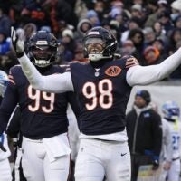 Jan 4, 2026; Chicago, Illinois, USA; Chicago Bears defensive end Montez Sweat (98) celebrates after a sack against the Detroit Lions during the first half at Soldier Field.