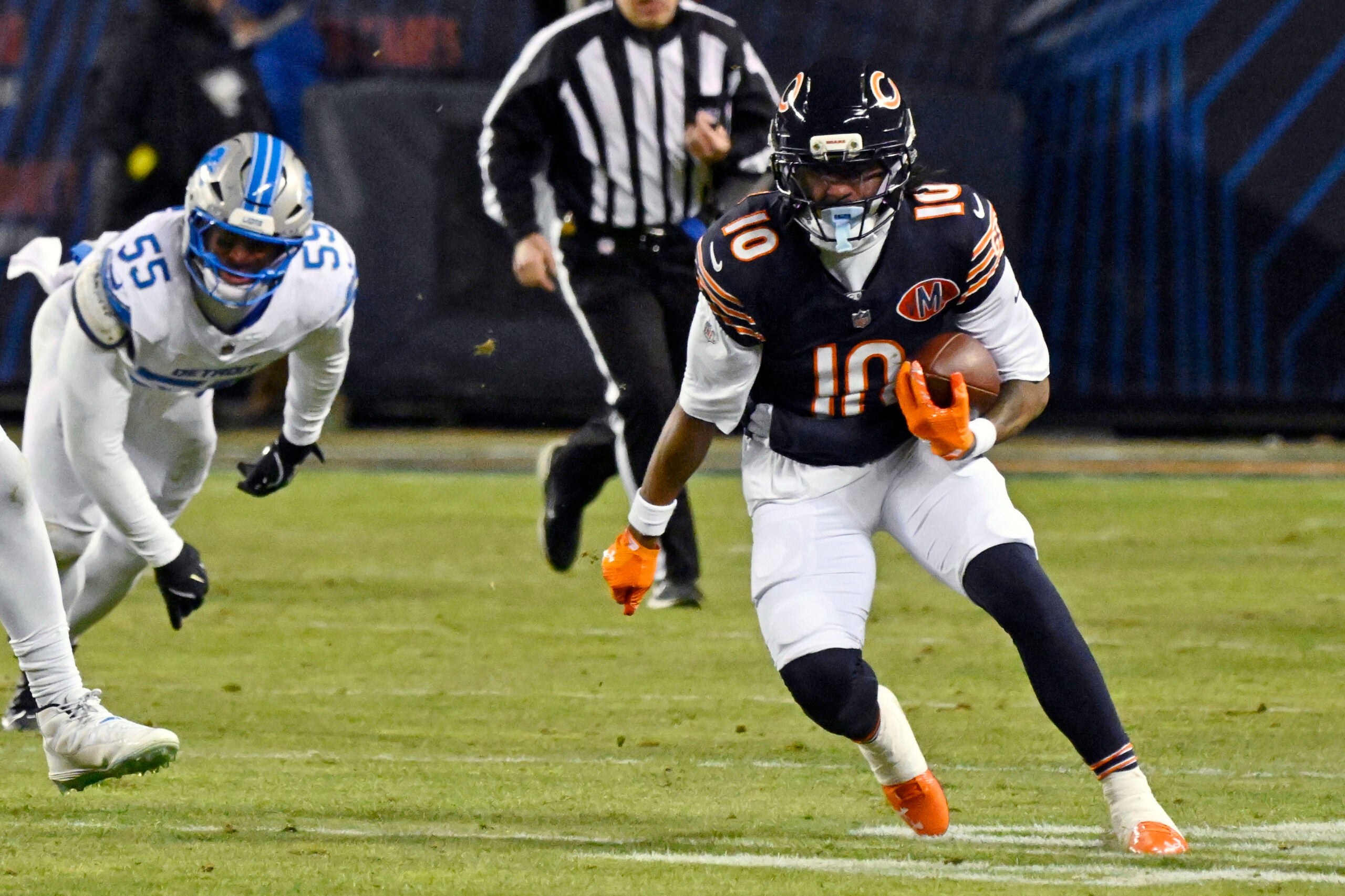 Jan 4, 2026; Chicago, Illinois, USA; Chicago Bears wide receiver Luther Burden III (10) runs with the ball against the Detroit Lions during the second half at Soldier Field.
