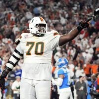 Miami (FL) Hurricanes offensive lineman Markel Bell (70) celebrates after going up 31-27 against the Mississippi Rebels late in the fourth quarter during the Vrbo Fiesta Bowl and CFP semifinal game at State Farm Stadium on Jan. 8, 2026, in Glendale.