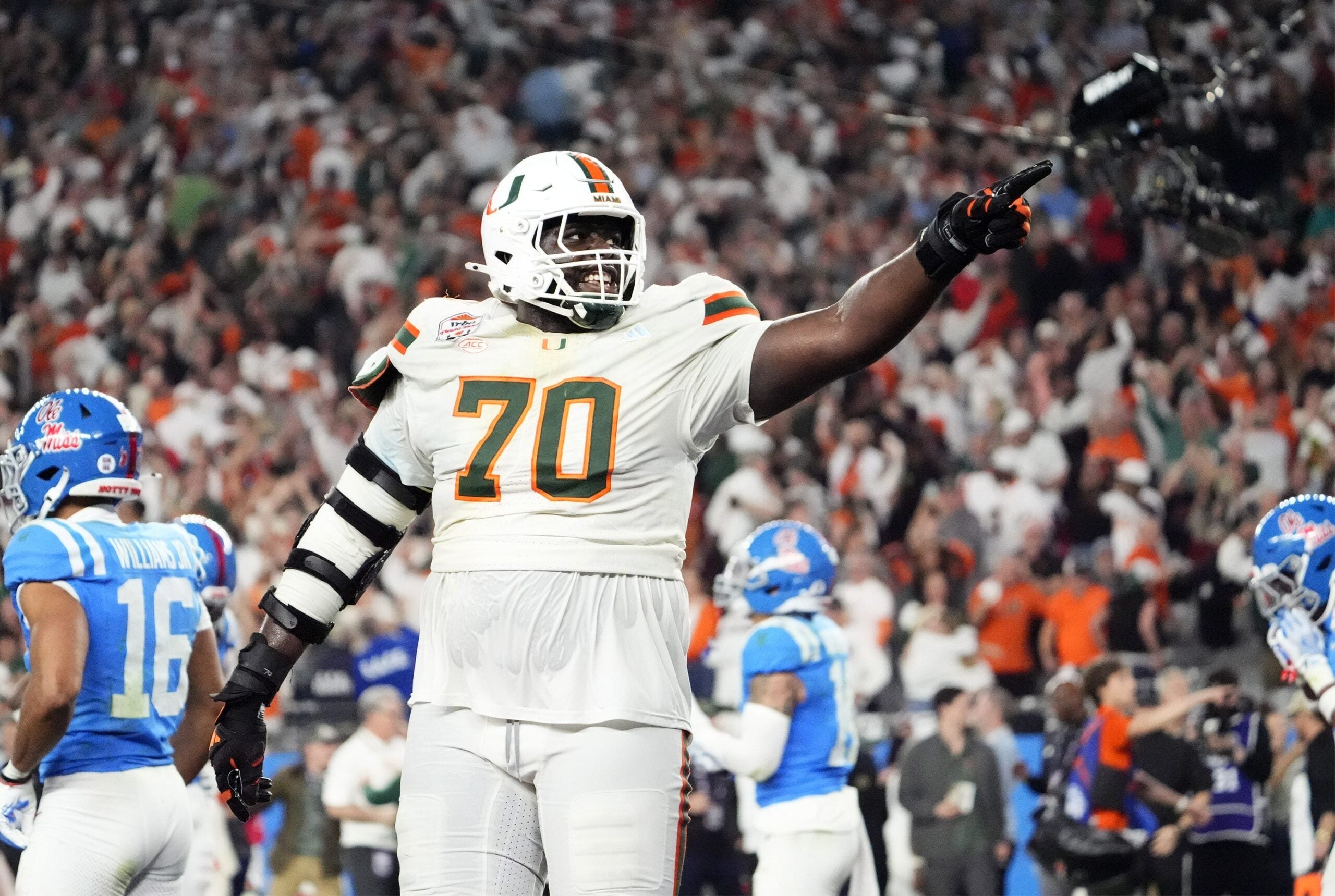 Miami (FL) Hurricanes offensive lineman Markel Bell (70) celebrates after going up 31-27 against the Mississippi Rebels late in the fourth quarter during the Vrbo Fiesta Bowl and CFP semifinal game at State Farm Stadium on Jan. 8, 2026, in Glendale.