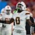 Miami Hurricanes defensive back Keionte Scott (0) runs onto the field at the start of the CFP Fiesta Bowl against Ole Miss at the State Farm Stadium, in Glendale, Ariz., on Thursday, Jan. 8, 2026.