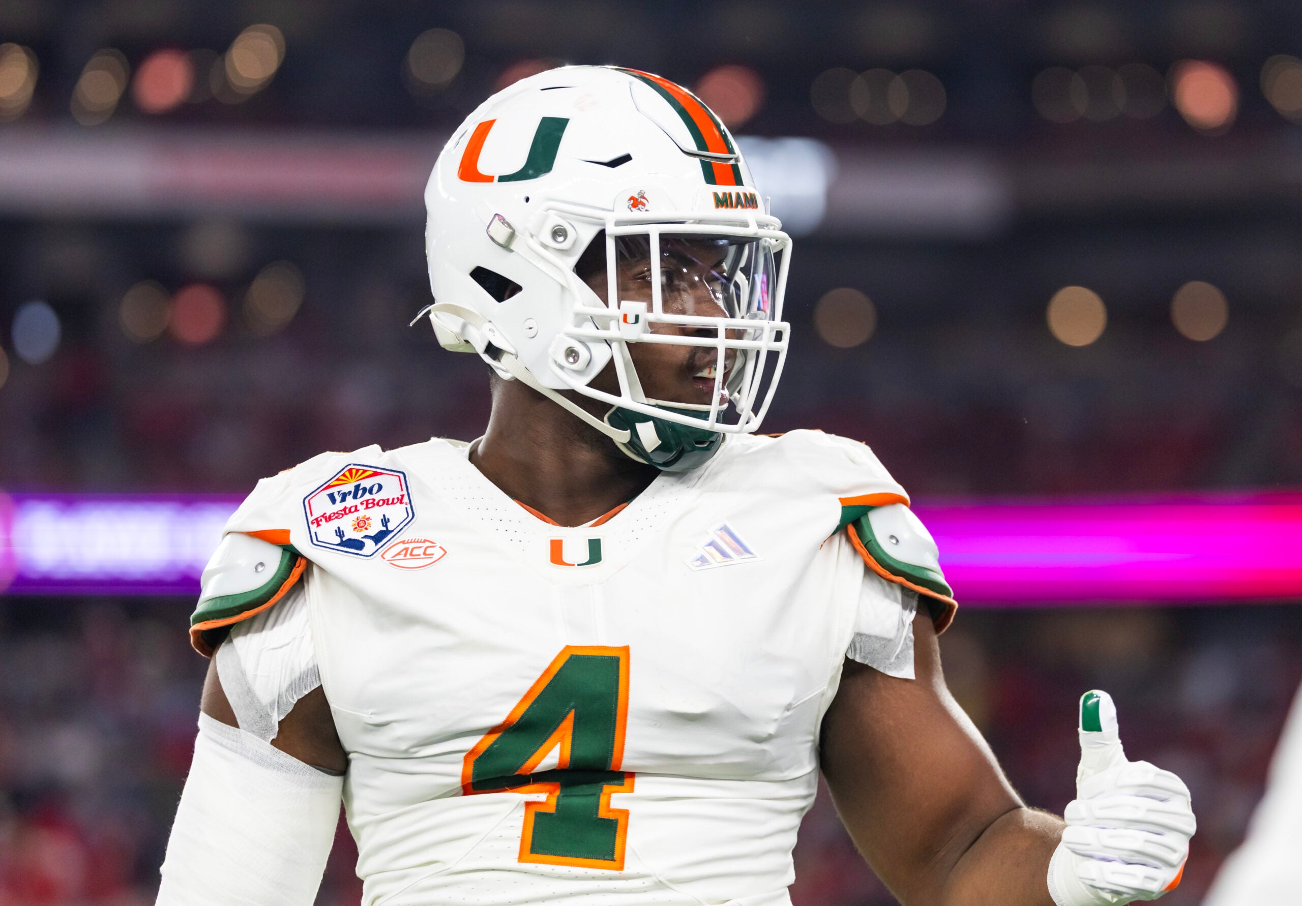 Jan 8, 2026; Glendale, AZ, USA; Miami Hurricanes defensive lineman Rueben Bain Jr. (4) against the Mississippi Rebels during the 2026 Fiesta Bowl and semifinal game of the College Football Playoff at State Farm Stadium.