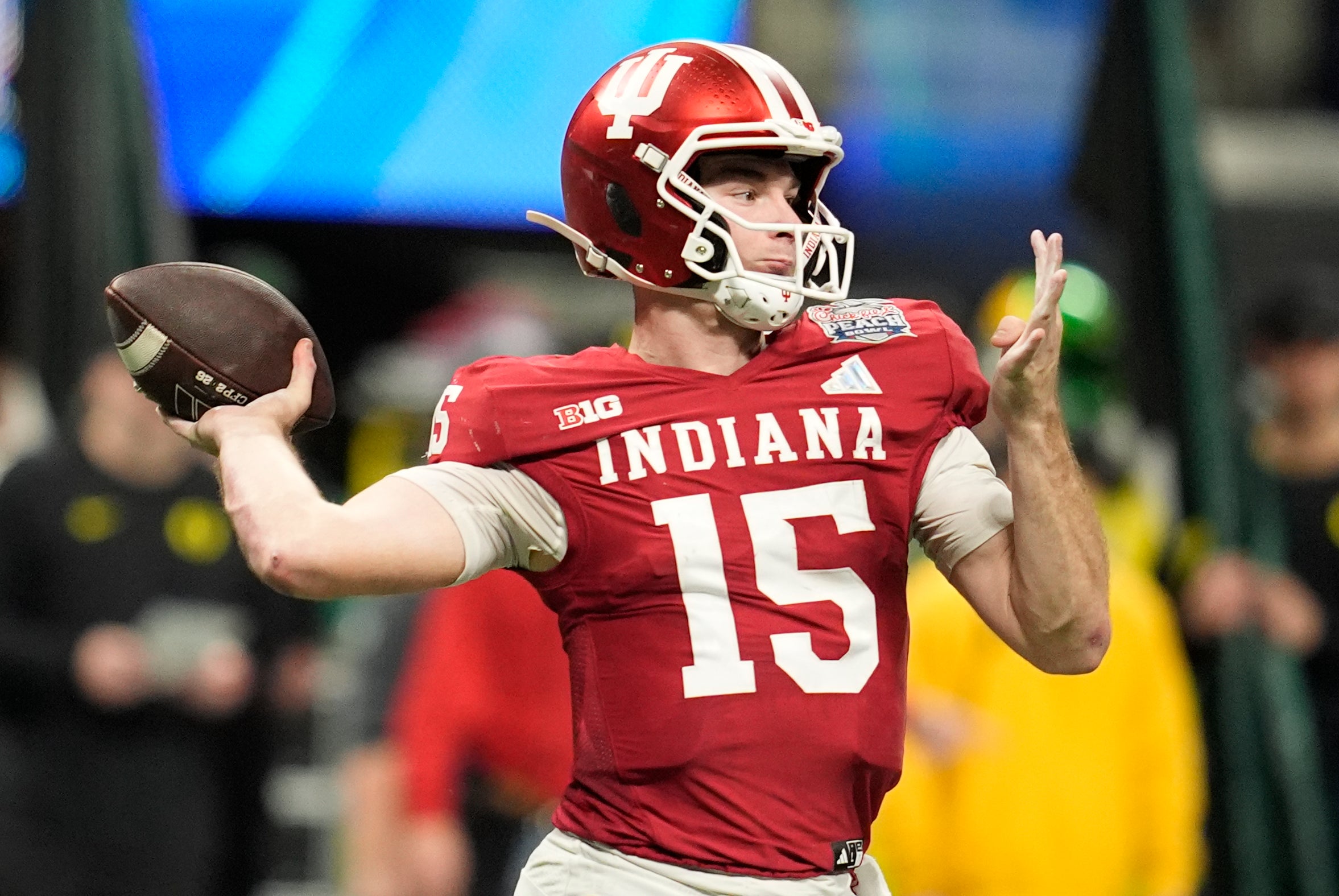 Jan 9, 2026; Atlanta, GA, USA; Indiana Hoosiers quarterback Fernando Mendoza (15) throws a pass against the Oregon Ducks during the third quarter of the 2025 Peach Bowl and semifinal game of the College Football Playoff at Mercedes-Benz Stadium