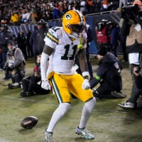 Jan 10, 2026; Chicago, IL, USA; Green Bay Packers wide receiver Jayden Reed (11) reacts after scoring touchdown against the Chicago Bears during the first half of an NFC Wild Card Round game at Soldier Field.
