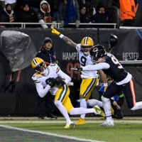 Jan 10, 2026; Chicago, IL, USA; Green Bay Packers wide receiver Matthew Golden (0) runs after the catch to score a touchdown against the Chicago Bears during the second half of an NFC Wild Card Round game at Soldier Field.