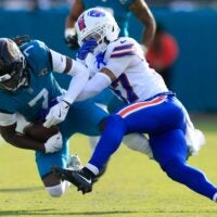Jacksonville Jaguars wide receiver Brian Thomas Jr. (7) is tackled by Buffalo Bills cornerback Jordan Hancock (37) during the third quarter of an NFL football AFC Wild Card playoff matchup, Sunday, Jan. 11, 2026, in Jacksonville, Fla. The Bills defeated the Jaguars 27-24.
