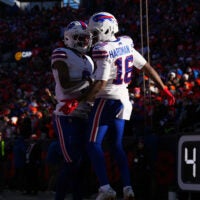 Jan 17, 2026; Denver, CO, USA; Buffalo Bills wide receiver Keon Coleman (0) congratulates wide receiver Mecole Hardman Jr. (16) after a touchdown during the first quarter of an AFC Divisional Round playoff game against the Denver Broncos at Empower Field at Mile High.
