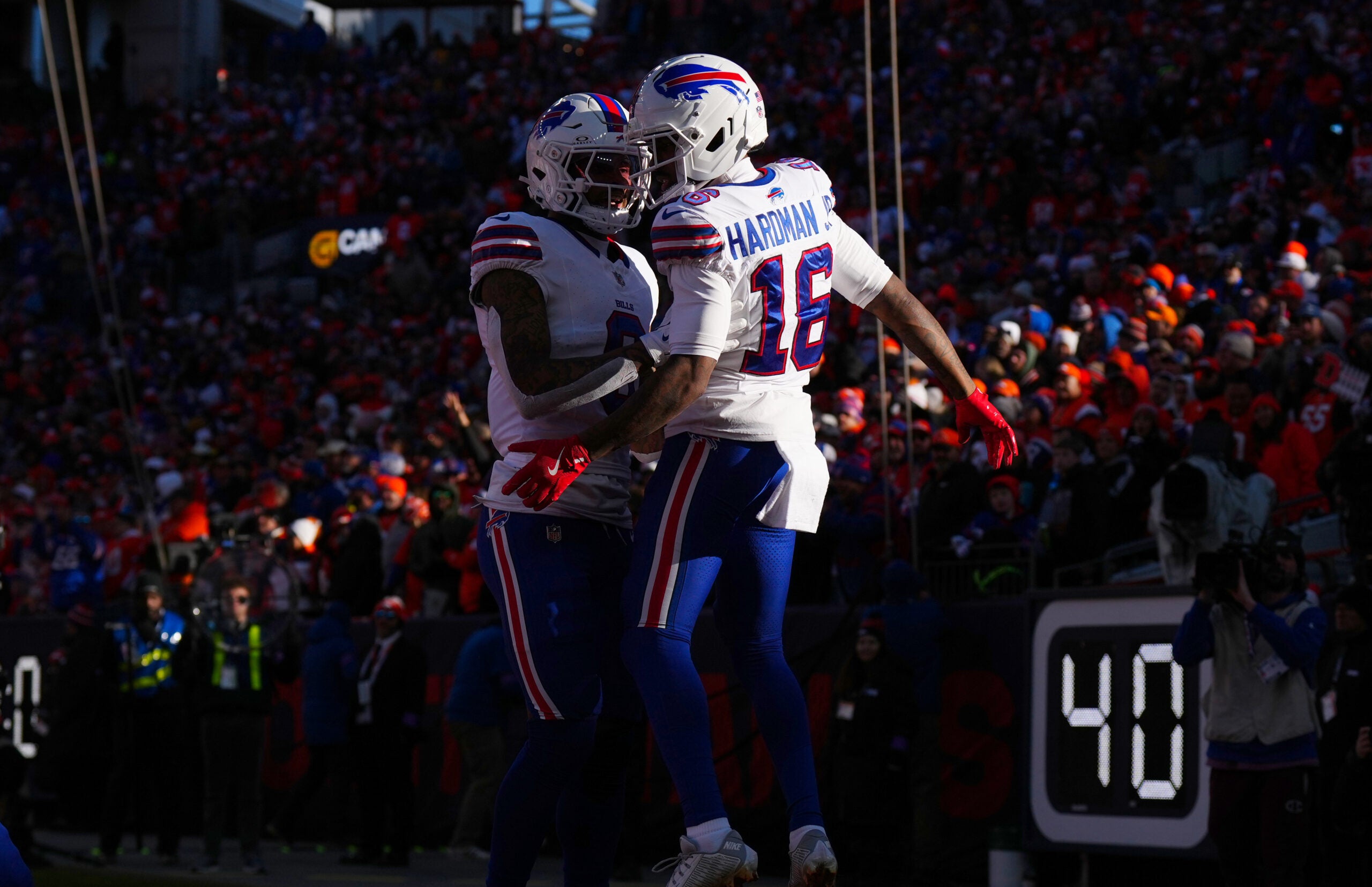 Jan 17, 2026; Denver, CO, USA; Buffalo Bills wide receiver Keon Coleman (0) congratulates wide receiver Mecole Hardman Jr. (16) after a touchdown during the first quarter of an AFC Divisional Round playoff game against the Denver Broncos at Empower Field at Mile High.
