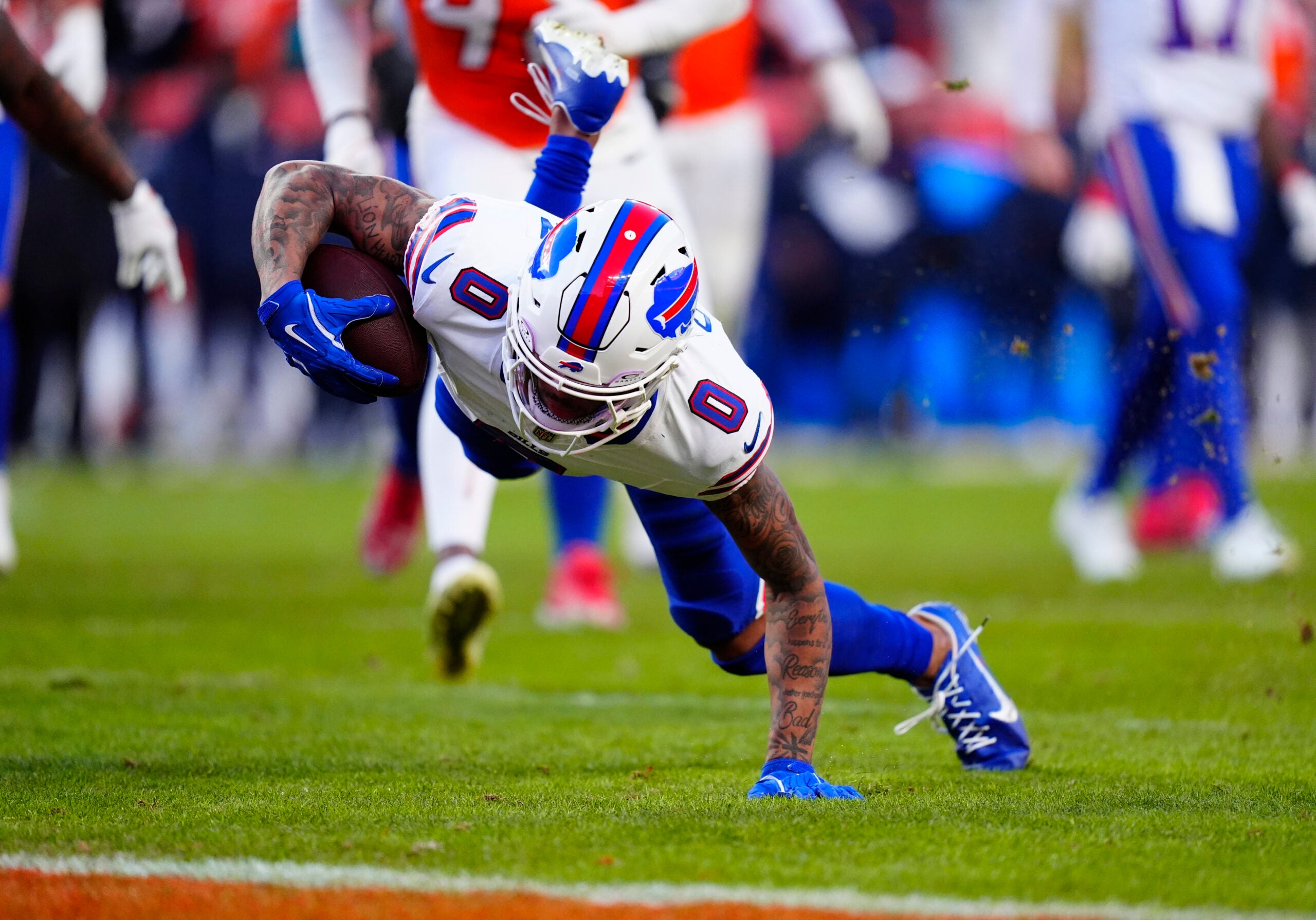 Jan 17, 2026; Denver, CO, USA; Buffalo Bills wide receiver Keon Coleman (0) scores a touchdown during the third quarter of an AFC Divisional Round playoff game against the Denver Broncos at Empower Field at Mile High.
