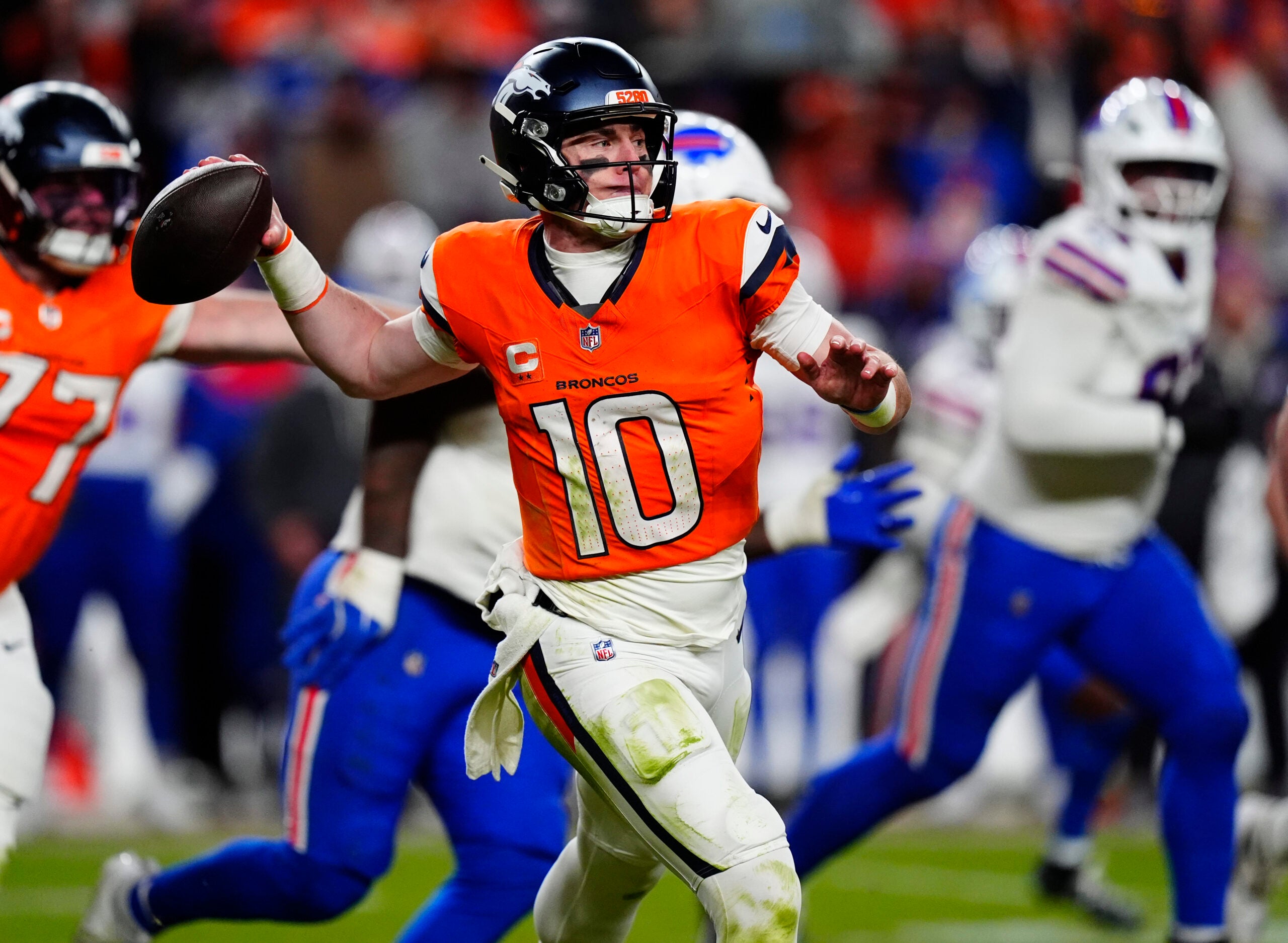 Jan 17, 2026; Denver, CO, USA; Denver Broncos quarterback Bo Nix (10) throws during the fourth quarter of an AFC Divisional Round playoff game against the Buffalo Bills at Empower Field at Mile High.