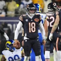 Jan 18, 2026; Chicago, IL, USA; Chicago Bears quarterback Caleb Williams (18) looks on against the Los Angeles Rams during overtime of an NFC Divisional Round game at Soldier Field.