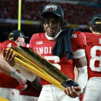 Jan 19, 2026; Miami Gardens, FL, USA; Indiana Hoosiers defensive back D'Angelo Ponds (5) reacts with the trophy after the College Football Playoff National Championship game at Hard Rock Stadium.