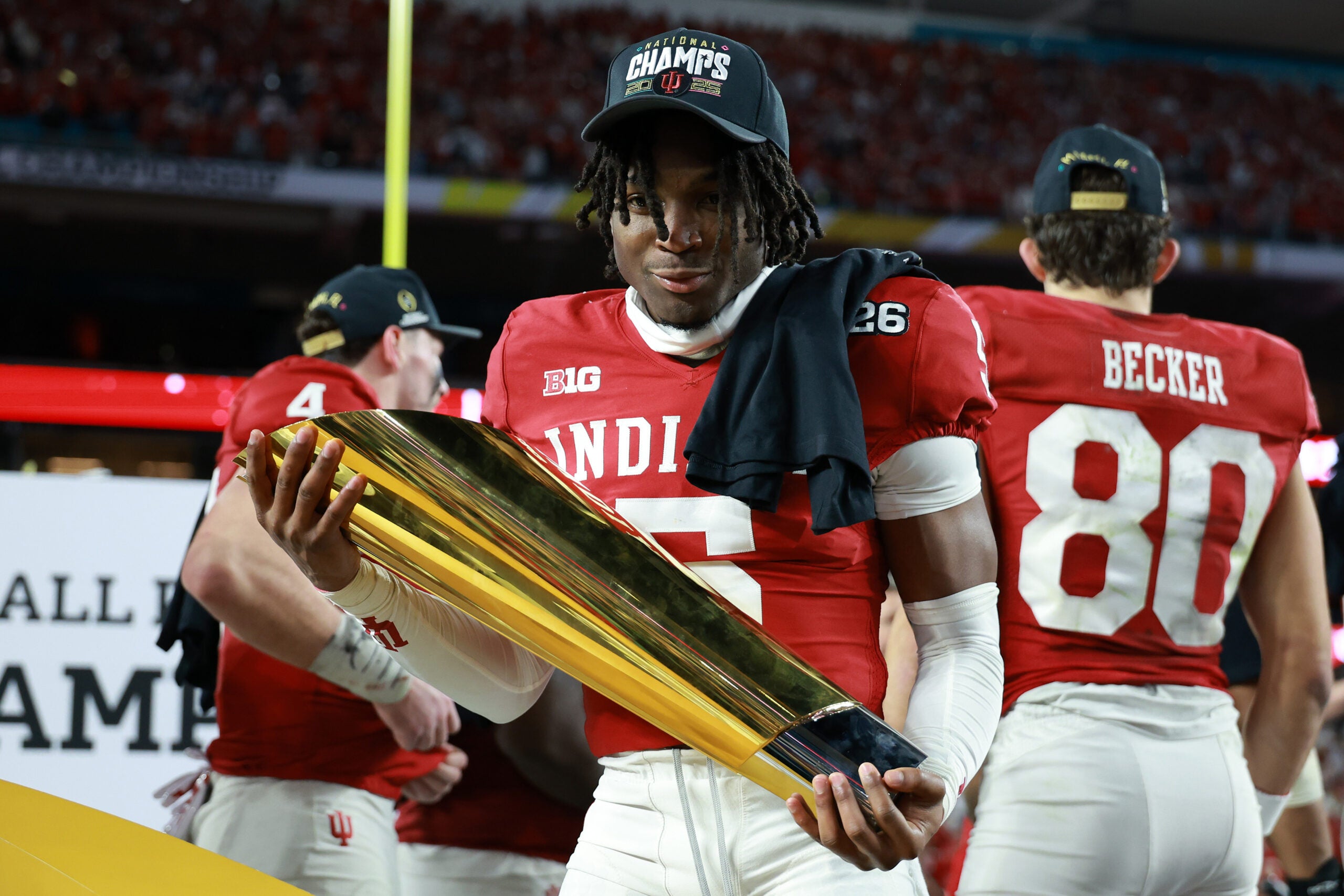 Jan 19, 2026; Miami Gardens, FL, USA; Indiana Hoosiers defensive back D'Angelo Ponds (5) reacts with the trophy after the College Football Playoff National Championship game at Hard Rock Stadium.