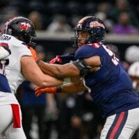 Jan 27, 2026; Frisco, TX, USA; East offensive lineman Pete Nygra (50) blocks West defensive lineman James Thompson Jr. (90) during the first half at the Ford Center at the Star.