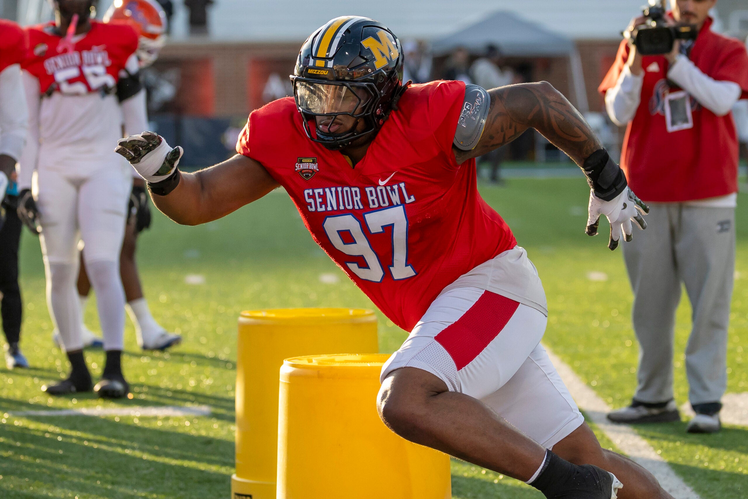 Jan 29, 2026; Mobile, AL, USA; American defensive tackle Chris Mcclellan (97) of Missouri of Boston College works in a drill during American Senior Bowl practice at Hancock Whitney Stadium.