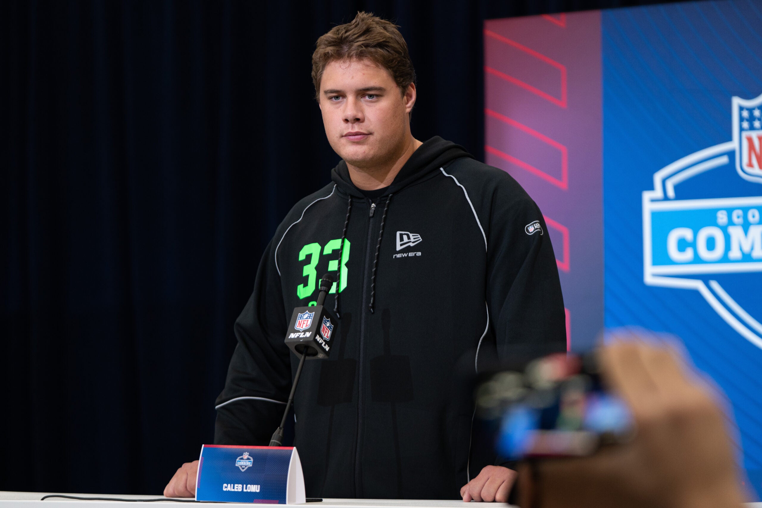 Feb 28, 2026; Indianapolis, IN, USA; Utah offensive lineman Caleb Lomu (OL33) speaks to members of the media during the NFL Combine at the Indiana Convention Center.