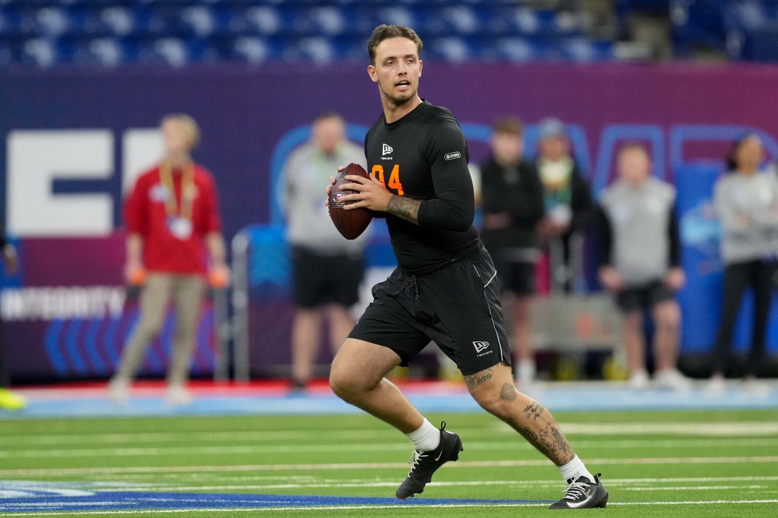 Feb 28, 2026; Indianapolis, IN, USA; Miami quarterback Carson Beck (QB04) during the NFL Scouting Combine at Lucas Oil Stadium.