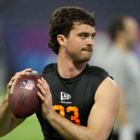Feb 28, 2026; Indianapolis, IN, USA; Illinois quarterback Luke Altmyer (QB03) during the NFL Scouting Combine at Lucas Oil Stadium.