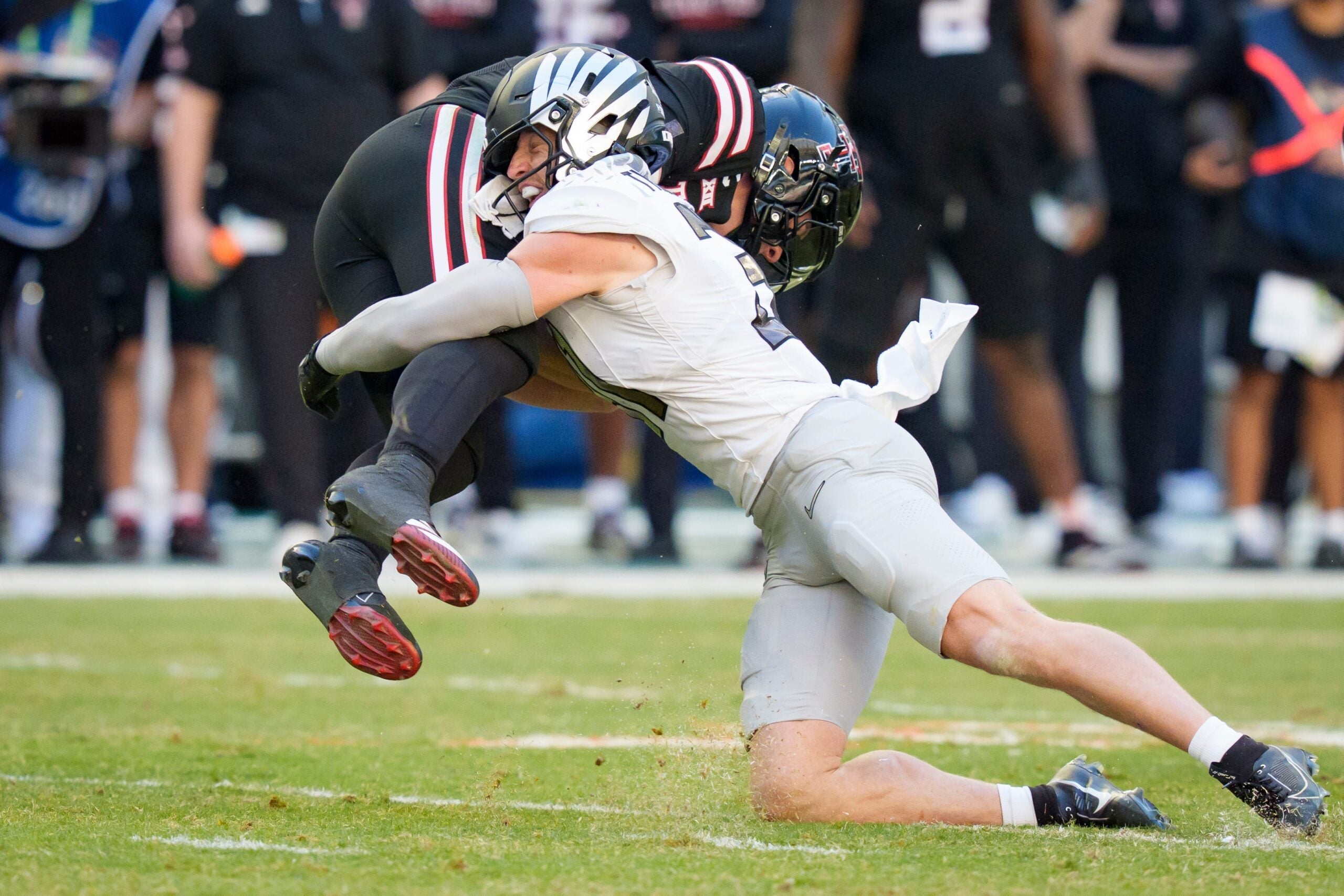 Oregon defensive back Dillon Thieneman, right, brings down Texas Tech quarterback Behren Morton as the Oregon Ducks take on the Texas Tech Red Raiders in the Orange Bowl on Jan. 1, 2026, at Hard Rock Stadium in Miami, Florida.