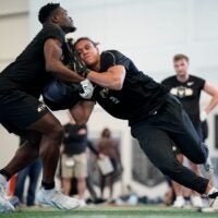 Vanderbilt tight end Emmanuel Adebi, left. and tight end Eli Stowers, right, run drills during football pro day at Vanderbilt University in Nashville, Tenn., Friday, March 20, 2026.