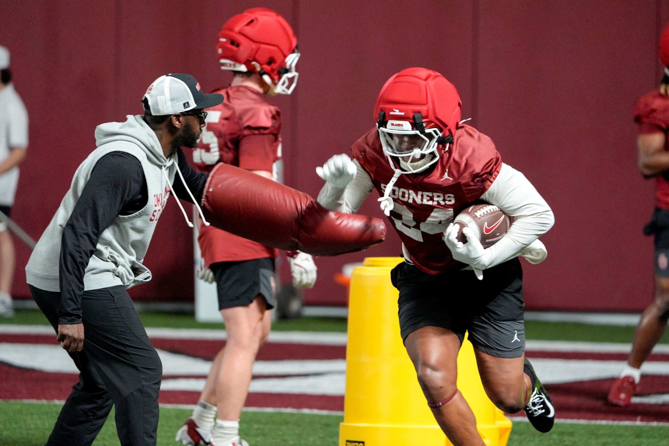 Xavier Robinson (24) runs rills during an Oklahoma (OU) football practice in Norman, Okla., on Wednesday, March 25, 2026.