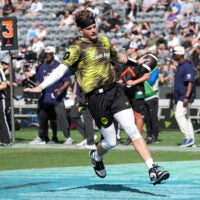 Mar 21, 2026; Los Angeles, CA, USA; Wildcats FFC quarterback Joe Burrow carries the ball during the Fanatics Flag Football Classic at BMO stadium.