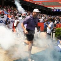 Florida head coach Jon Sumrall and the team blasts out onto the field before the Orange and Blue game at Steve Spurrier Field at Ben Hill Griffin Stadium in Gainesville, FL on Saturday, April 11, 2026.