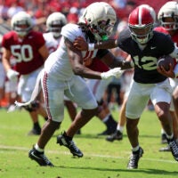 Apr 11, 2026; Tuscaloosa, AL, USA; Alabama Crimson Tide quarterback Austin Mack (10) pursues quarterback Keelon Russell (12) during the Alabama A-Day spring football scrimmage game at Saban Field at Bryant-Denny Stadium.