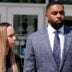 Former University of Michigan football coach Sherrone Moore and his wife Kelli Moore listen to his lawyer, Ellen Michaels, talk to the media after his suspended sentence ruling in the courtroom of Judge J. Cedric Simpson at 14A-1 District Court in Ann Arbor on Tuesday, April, 14, 2026.