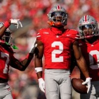 Ohio State Buckeyes safety Caleb Downs (2) celebrates an interception with cornerback Jermaine Mathews Jr. (7) abnd linebacker Sonny Styles (0) during the first half of the NCAA football game against the Grambling State Tigers at Ohio Stadium on Sept. 6, 2025.