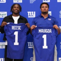 Apr 24, 2026; East Rutherford, NJ, USA; New York Giants draft picks Arvell Reese and Francis Mauigoa pose for a photo during the introductory press conference at Quest Diagnostics Training Center.