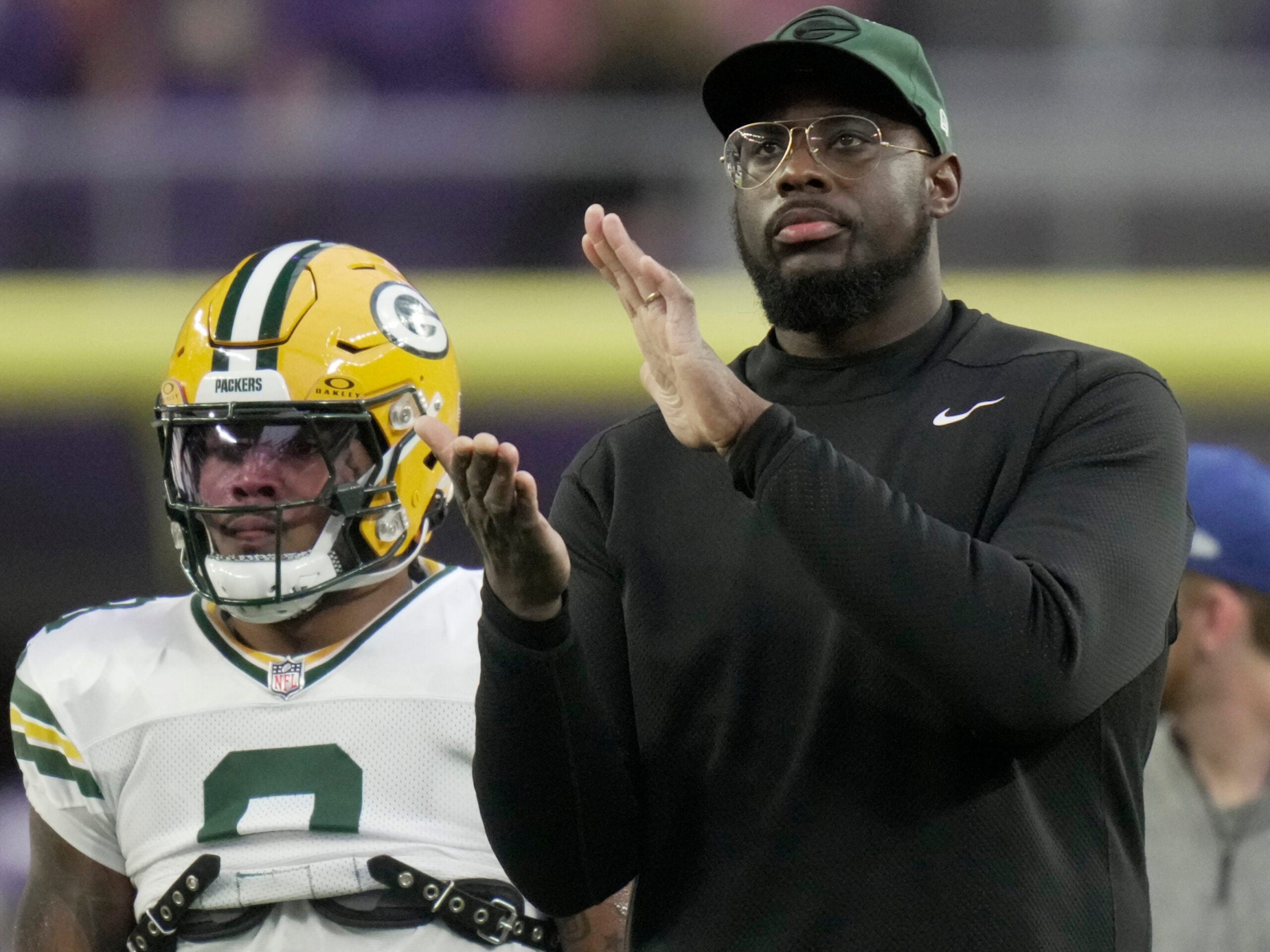 Green Bay Packers assistant defensive line coach Vince Oghobaase is shown before their game Sunday, December 29, 2024 at U.S. Bank Stadium in Minneapolis, Minnesota. The Minnesota Vikings beat the Green Bay Packers 27-25.