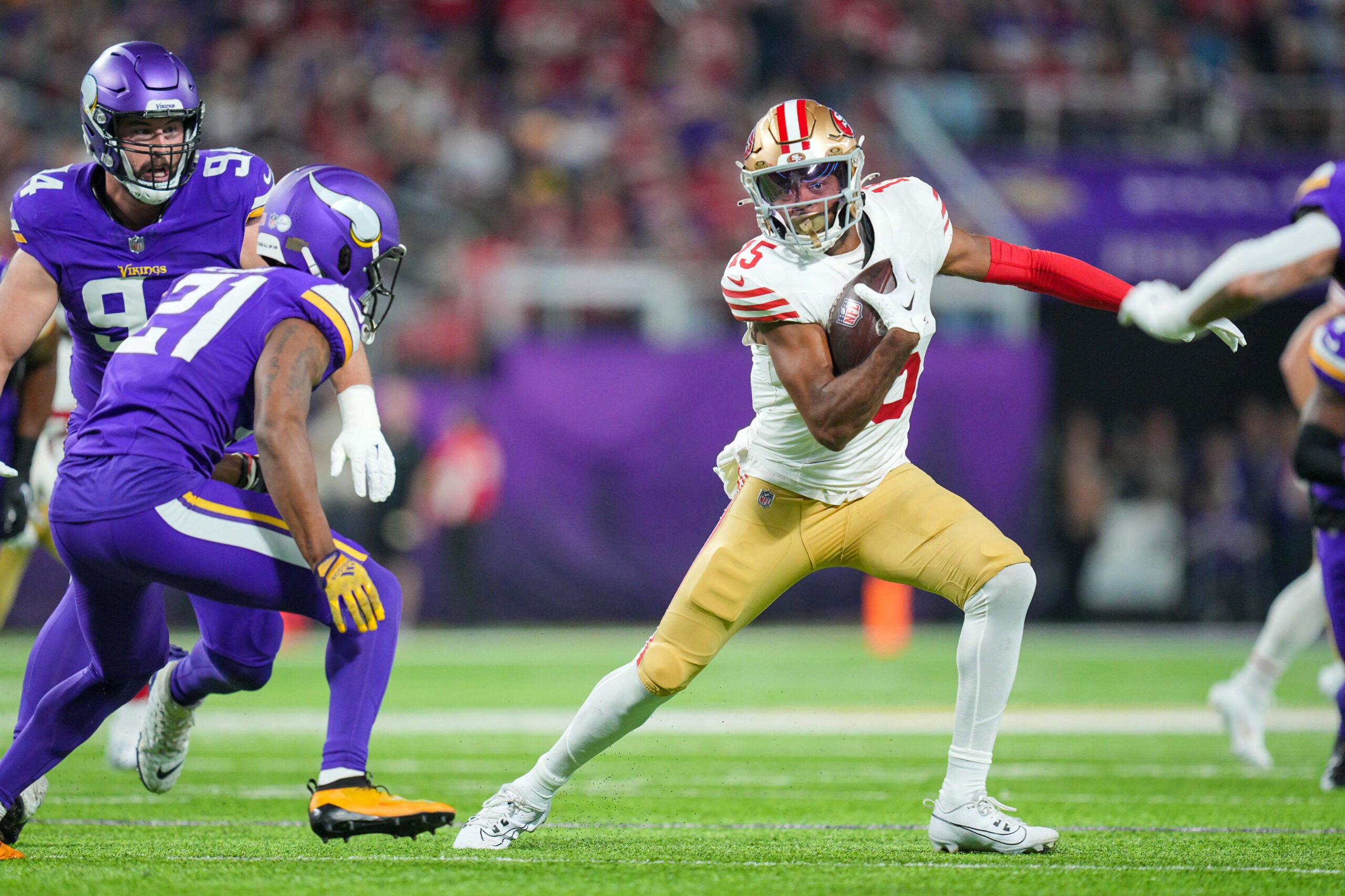 Oct 23, 2023; Minneapolis, Minnesota, USA; San Francisco 49ers wide receiver Jauan Jennings (15) runs after the catch against the Minnesota Vikings cornerback Akayleb Evans (21) in the first quarter at U.S. Bank Stadium.