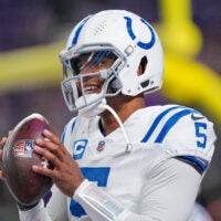 Nov 3, 2024; Minneapolis, Minnesota, USA; Indianapolis Colts quarterback Anthony Richardson (5) warms up before the game against the Minnesota Vikings at U.S. Bank Stadium.