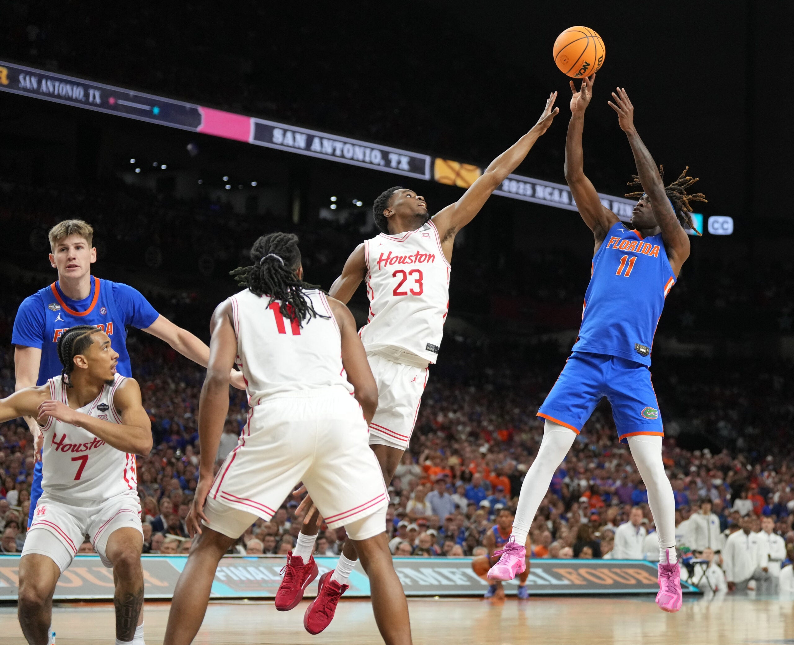 Apr 7, 2025; San Antonio, TX, USA; Florida Gators guard Denzel Aberdeen (11) shoots over Houston Cougars guard Terrance Arceneaux (23) in the first half in the national championship game of the Final Four of the 2025 NCAA Tournament at the Alamodome.