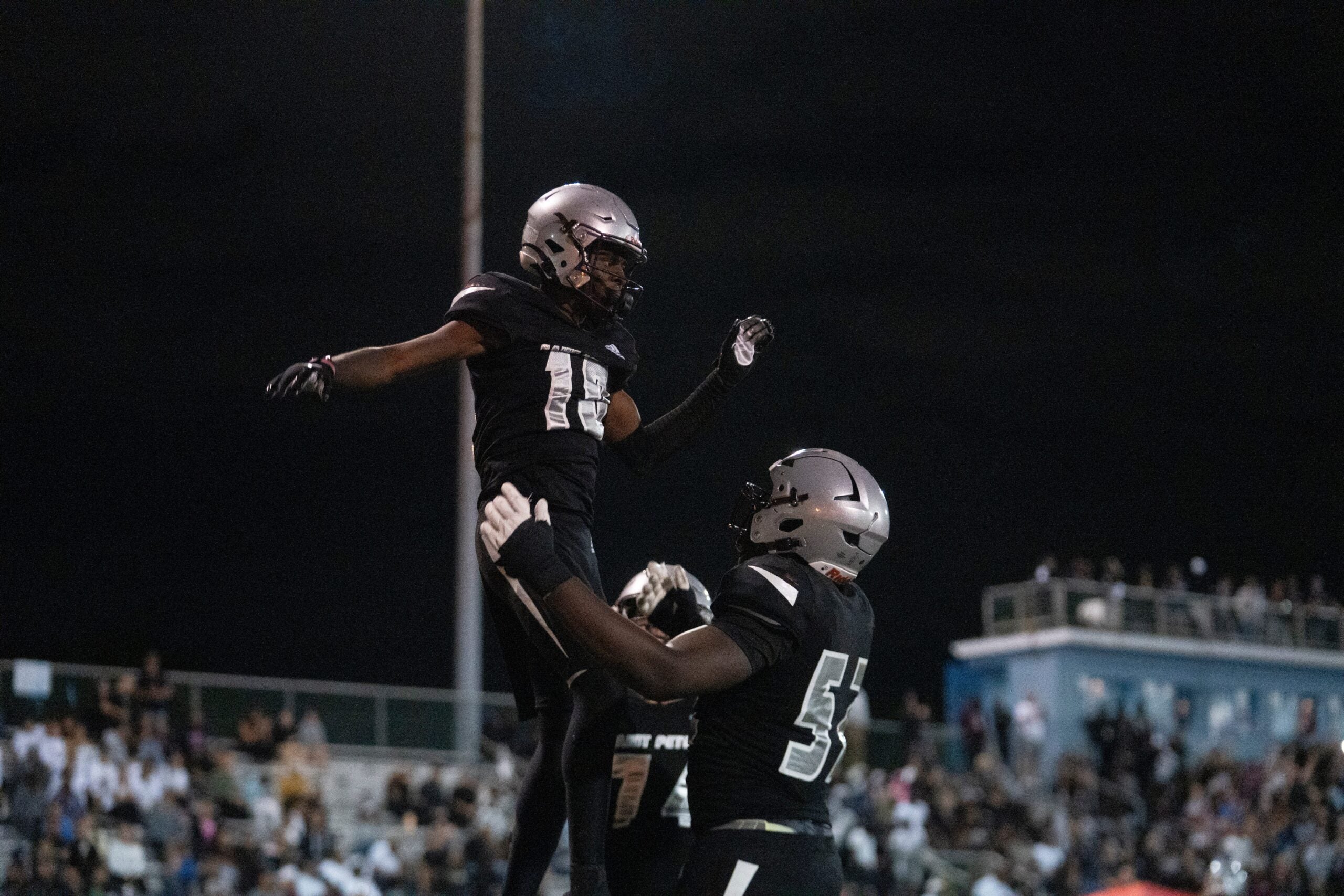 St. Peter Prep's Amari Jones (10) celebrates with his teammate Olubobola Oluwasemilore (52) during a high school football game between St. Peters Prep and Paramus Catholic in Jersey City on Friday, Aug. 29, 2025.