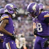 Nov 16, 2025; Minneapolis, Minnesota, USA; Minnesota Vikings wide receiver Jordan Addison (3) and wide receiver Justin Jefferson (18) celebrate a touchdown during the fourth quarter against the Chicago Bears at U.S. Bank Stadium.
