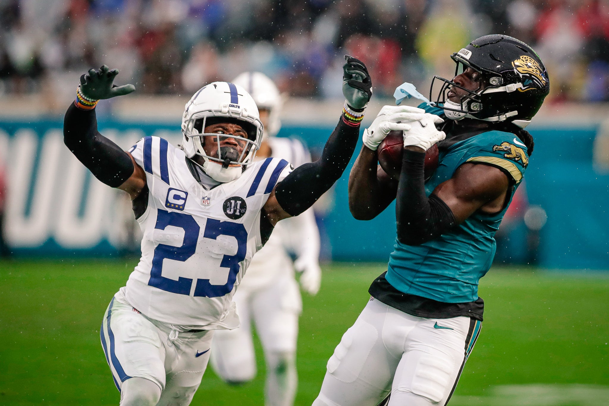 Dec 7, 2025; Jacksonville, Florida, USA;Jacksonville Jaguars wide receiver Brian Thomas Jr. (7) catches a pass over Indianapolis Colts cornerback Kenny Moore II (23) at EverBank Stadium.