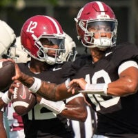 Aug. 19, 2025, Tuscaloosa, AL; Quarterbacks Austin Mack (10), Keelon Russell (12), and Ty Simpson (15) throw during practice for the Alabama Crimson Tide.