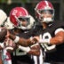 Aug. 19, 2025, Tuscaloosa, AL; Quarterbacks Austin Mack (10), Keelon Russell (12), and Ty Simpson (15) throw during practice for the Alabama Crimson Tide.