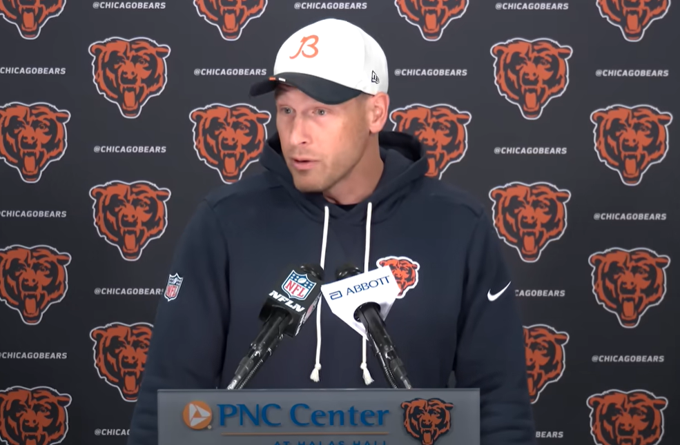 Chicago Bears head coach Ben Johnson talks with reporters during rookie minicamp.