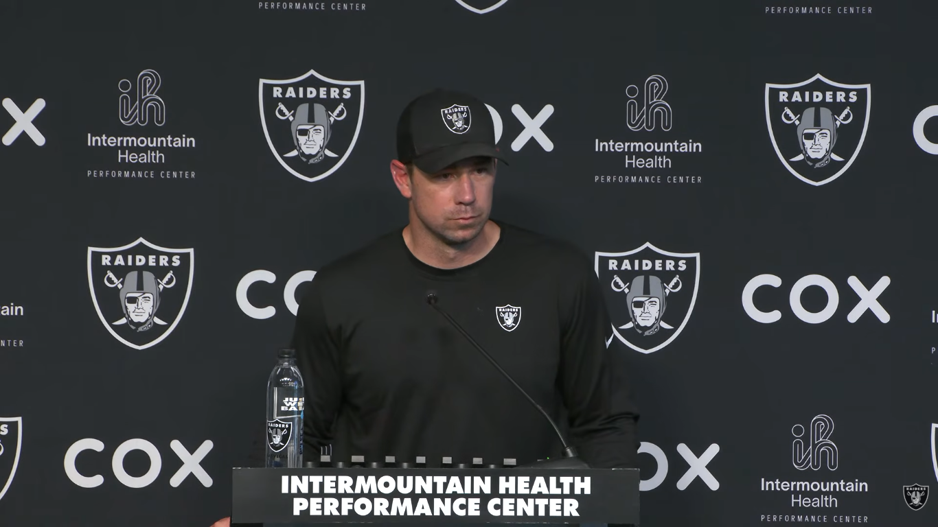 Las Vegas Raiders head coach Klint Kubiak at the podium talking about wide receiver Tre Tucker