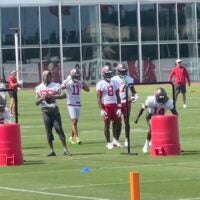 Buccaneers receivers Chris Godwin Jr. and Tez Johnson (15) participate in a drill during OTAs.