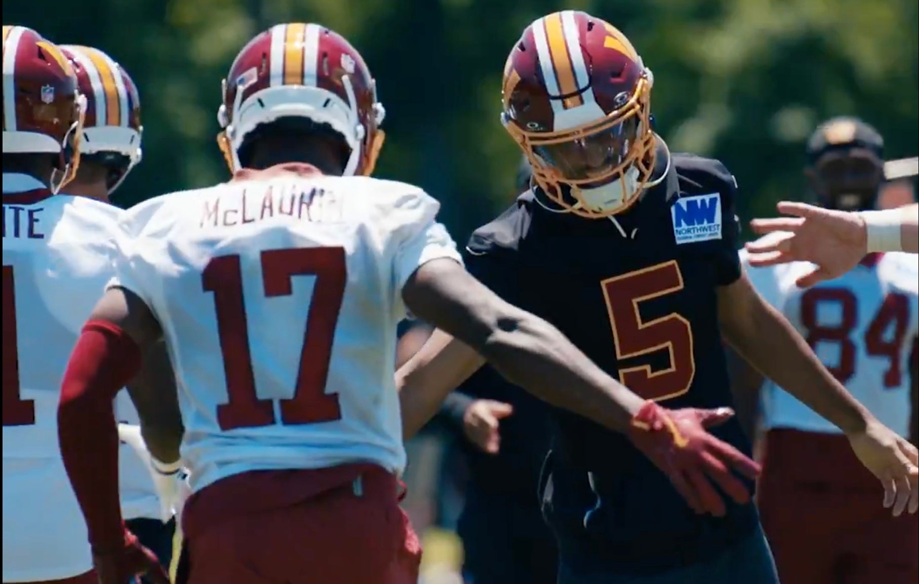 Jayden Daniels and Terry McLaurin celebrate after a big play in Commanders OTAs.