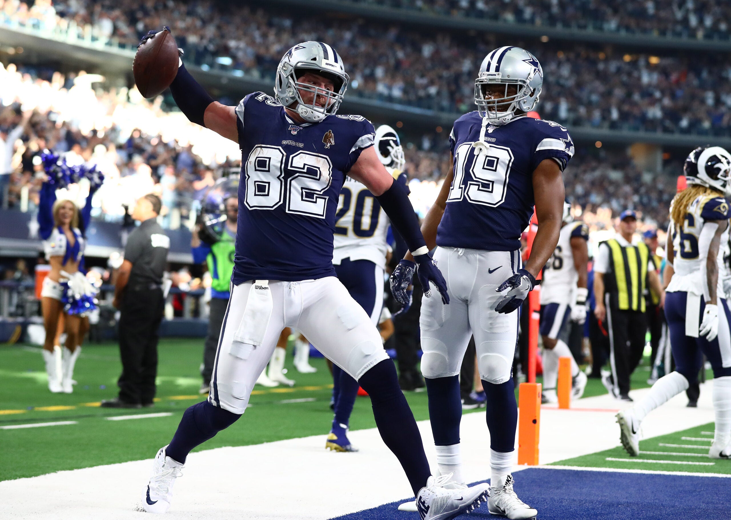 Dec 15, 2019; Arlington, TX, USA; Dallas Cowboys tight end Jason Witten (82) spikes to ball while celebrating his first quarter touchdown with receiver Amari Cooper (19) against the Los Angeles Rams at AT&T Stadium.