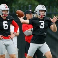 Ohio State Buckeyes quarterback Kyle McCord (6) watches as Quinn Ewers (3) throws during football training camp at the Woody Hayes Athletic Center in Columbus on Wednesday, Aug. 18, 2021.