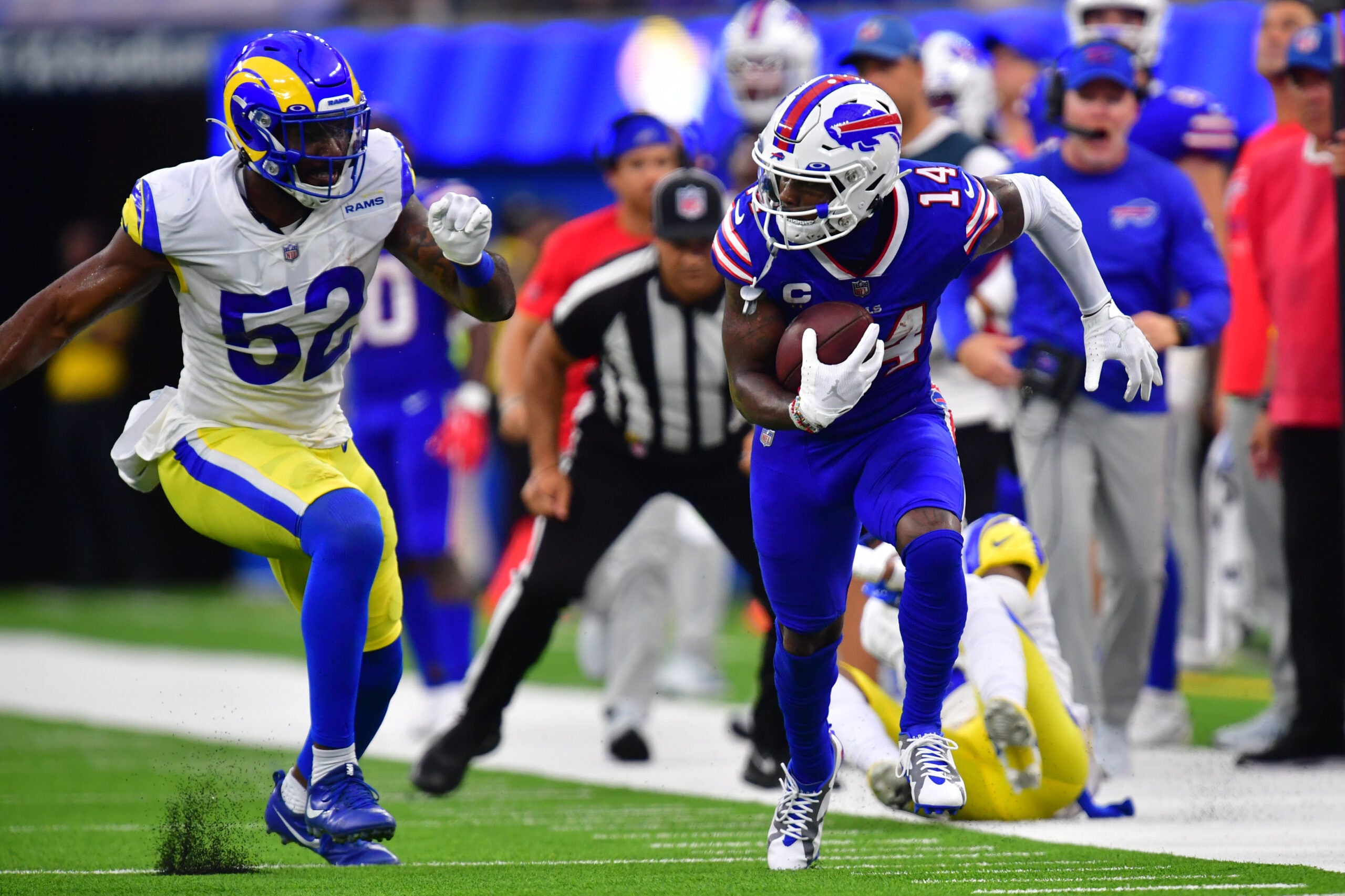 Sep 8, 2022; Inglewood, California, USA; Buffalo Bills wide receiver Stefon Diggs (14) runs the ball defended by Los Angeles Rams linebacker Terrell Lewis (52) in the second quarter at SoFi Stadium.
